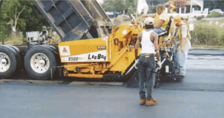 Workers prepare a bridge for deck waterproofing.