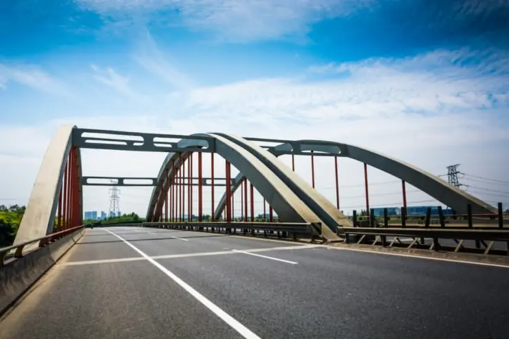 A steel deck bridge provides strength and durability for heavy traffic.