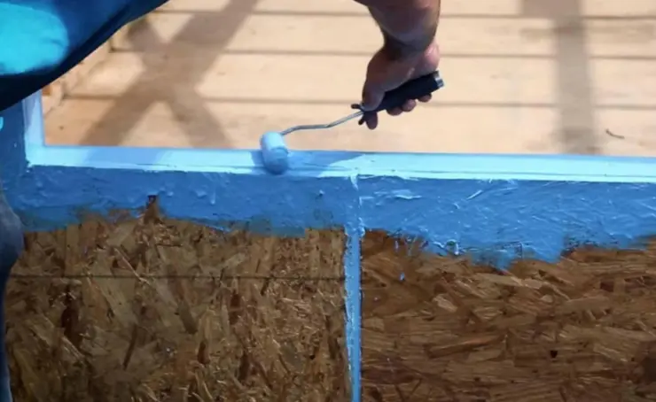 Applying waterproofing membrane with paint roller