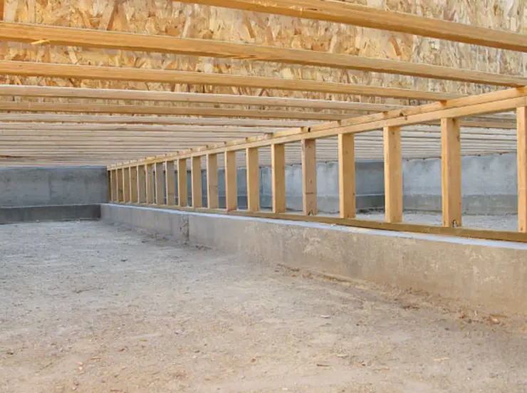 Wooden floor joists in encapsulated crawl space foundation